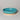 Turquoise ceramic dish on a light gray background