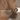 Close-up of a man with a beard applying a product, with text about a signature oil blend.