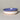 Three ceramic bowls with blue, white, and beige bases on a gray background