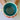 Teal mug held by a person with a neutral background