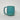 Teal ceramic mug on a light gray background