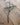 Heart metal cross on a wooden surface