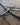 Promise Cross metal trivet on a wooden surface