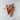 Three wooden crosses on a light gray surface