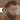 Man applying oil-based pomade to his hair with text instructions.