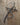 Metal heart cross on a wooden surface