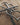Wrought iron heart-shaped cross close-up on a wooden surface
