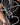 Metal heart-shaped cross being shaped by a blacksmith's tools