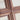 Close-up of a Walnut Layered Wooden Cross with interlocking design on a beige background
