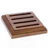 Wooden soap dish with slotted design on a white background