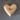 Wooden heart-shaped object with 'hope' engraved on a gray background