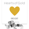 Silver 'Kind Heart' ring with a gold heart symbol on a white background