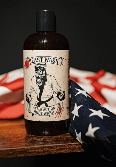 Bottle of 'Beast Wash' after action body wash with a label featuring a graphic design on an American flag background.