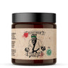 Jar of 'Beast Balm' with a label featuring a graphic design on a white background