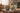 Framed photo of a boy with a dog on a wooden table in a living room.