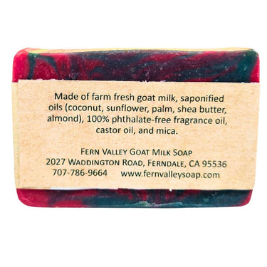 Bar of Amber Alert Natural Goat Milk Soap with a label detailing ingredients and contact information on a white background