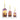 Three glass bottles with floral designs and lit candles inside on a white background