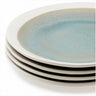 Stack of ceramic plates with a light blue gradient on a white background
