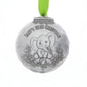 Silver ornament with elephant design and 'Baby's First Christmas' text on a white background