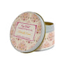 Candle tin with floral design and visible brand name on a white background