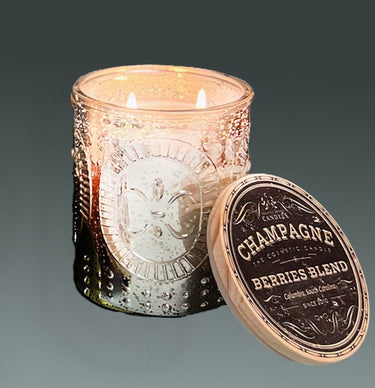 Soy Candle Champagne and Berries in Silver Mercury Glass  jar with a label on a gray background
