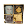 Set of four Cheers Gift Set Soy Lotion Candles Champagne Inspired Scents containers in a decorative box with 'Cheers' theme.
