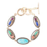 Multicolored gemstone bracelet with gold accents on a white background