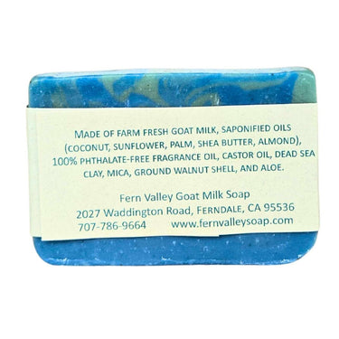 Blue bar of Natural Goat Milk Soap Dead Sea Mineral Soap with a label on a white background