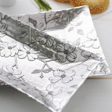 Silver Serving Tray with floral embossing on a white surface