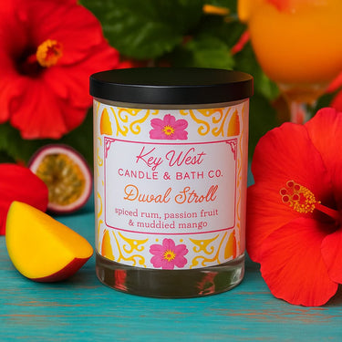 Candle with a decorative label with flowers in the background
