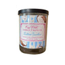 Candle with a label from Key West Candle & Bath Co. on a white background