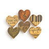 Set of wooden heart-shaped coasters with musical designs on a white background