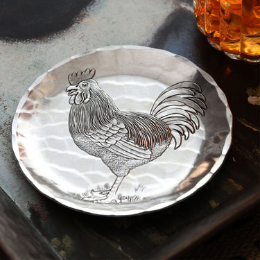 Silver Farmhouse Rooster Drink Coaster with a rooster design on a reflective surface.