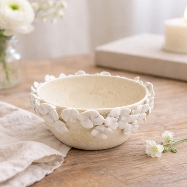 Decorative ceramic bowl with floral Posies  on a wooden surface