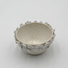 Ceramic bowl with floral patterns on a white background
