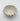 Ceramic bowl with decorative edge on a white background