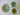 Three ceramic bowls with green and beige patterns on a white background