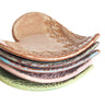 Set of ceramic bowls with textured surfaces on a white background