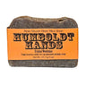 Bar of Heavy-duty goat milk hand cleaner Original Woodsman bar soap with 'Humboldt Hands' label on an orange background