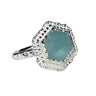 Silver ring with a blue gemstone on a white background