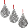Three teardrop-shaped gnome ornaments with intricate designs on a white background.