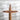 Close-up of a Wooden cross against a textured white background