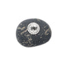 Decorative stone with a circular emblem on a white background