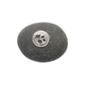 Round gray stone with a silver circular emblem on a white background