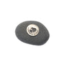 Black stone with a silver heart-shaped charm on a white background