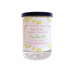 Candle with a label featuring lemons and 'Key West Candle & Bath Co' branding on a white background.