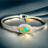Silver bracelet with a turquoise stone on a dark background
