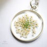 Keychain with pressed flowers Pressed Botanical Pendants on a white background