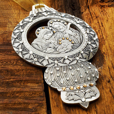Decorative silver and gold ornament on a wooden surface