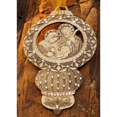 Decorative wall hanging with religious scene on a wooden background
